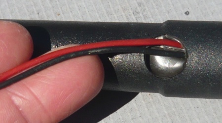 Close up of exposed wire on low-fuel sensor